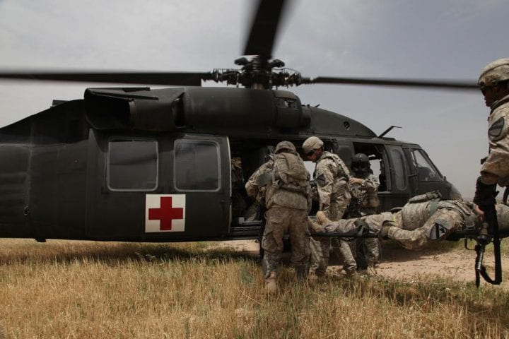 U.S. Army soldiers from 2nd Battalion, 12th Cavalry Regiment, 4th Brigade, 1st Cavalry Division, practice loading patients into a UH-60 Black Hawk helicopter during medical evacuation training at Contingency Operation Site Warrior, Kirkuk province, Iraq, May 6, 2011, in support of Operation New Dawn.  (Photo by: Spc. Sara Wakai)
